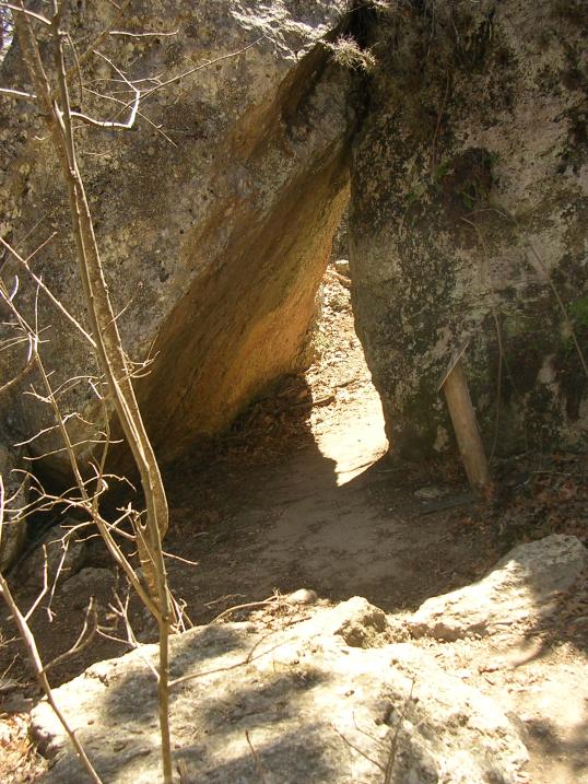 The path goes through the rocks