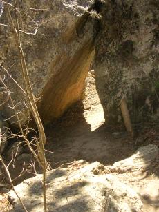 The path goes through the rocks